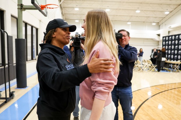 Head Coach Teresa Weatherspoon hugs newly drafted Chicago Sky player Brynna Maxwell after Maxwell answered media questions at Sachs Recreation Center in Deerfield on April 24, 2024. (Eileen T. Meslar/Chicago Tribune)