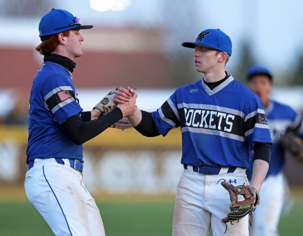 Burlington Central's Michael Person (5), left congratulates Brady Gilroy (7) after the final out of a 9 inning game against Jacobs during a Fox Valley Conference game on Wednesday, April, 24, 2024 in Algonquin. Burlington Central won, 10-6.H. Rick Bamman / For the Beacon News