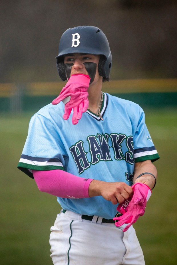 Bartlett's Josh Colaizzi (27) puts on batting gloves before his turn at bat against the Larkin Royals during a game in Bartlett on Wednesday, April 10, 2024. (Nate Swanson/for The Beacon-News)