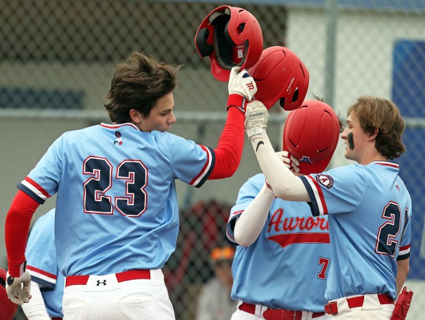 West Aurora's Carson Bantz (23) celebrates his first inning home run during a rain shortened Southwest Prairie Conference game against West Aurora in Aurora on Thursday, April 18, 2024. H. Rick Bamman / For the Beacon-News
