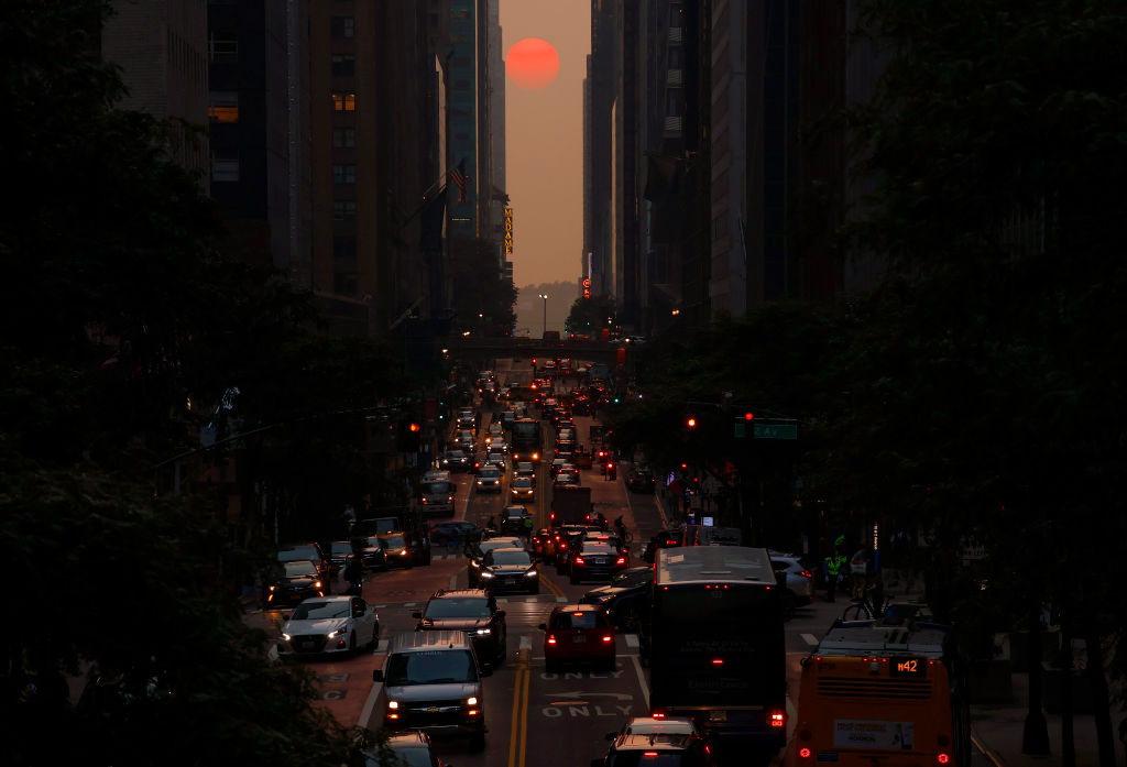 Smoke from wildfires in Canada shrouds the sun as it sets above 42nd Street in New York City on June 29, 2023.