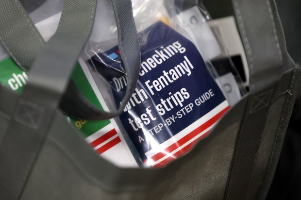 Fentanyl test strips are seen in bags being given out in January by employees and volunteers from the Department of Family and Support Services to the homeless population during the 2024 Point-In-Time Count. The strips can detect the presence of fentanyl, which is extremely deadly and often mixed with other illegal drugs. (Chris Sweda/Chicago Tribune)