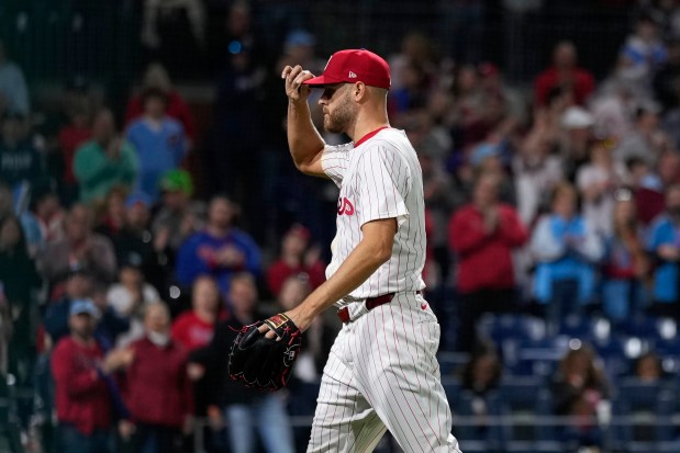 Phillies starter Zack Wheeler tips his cap to the crowd as he walks off the field after being pulled during the eighth inning against the White Sox on April 20, 2024, in Philadelphia. (Matt Slocum/AP)