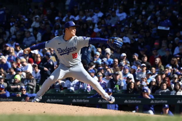 Dodgers starting pitcher Yoshinobu Yamamoto delivers against the Cubs in the first inning on April 6, 2024, at Wrigley Field. (John J. Kim/Chicago Tribune)