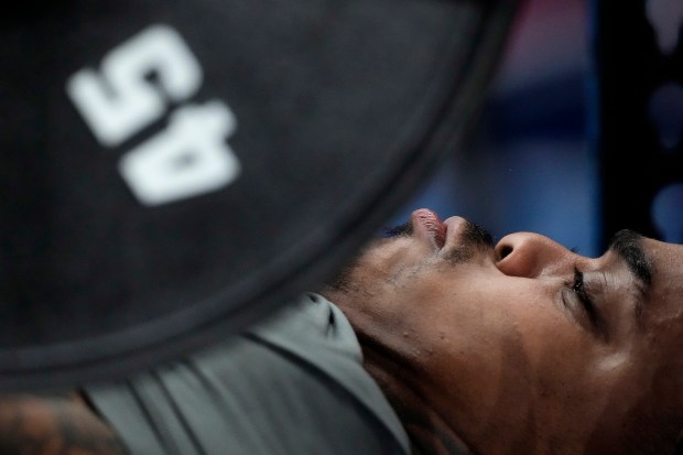 Texas defensive lineman Byron Murphy lifts weights during the NFL scouting combine on March 1, 2024, in Indianapolis. (AP Photo/Charlie Riedel)