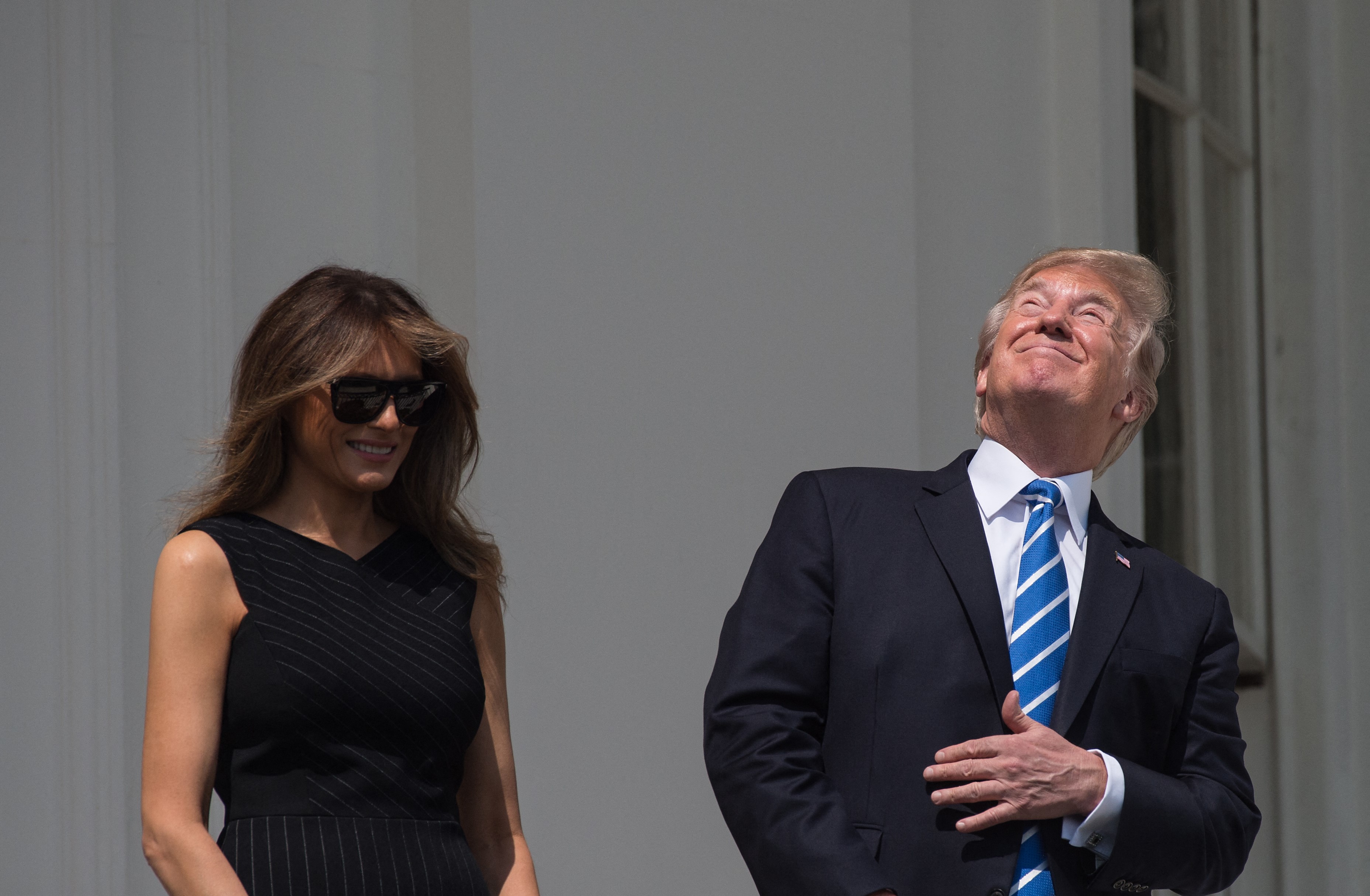 Donald Trump looking straight at the eclipse