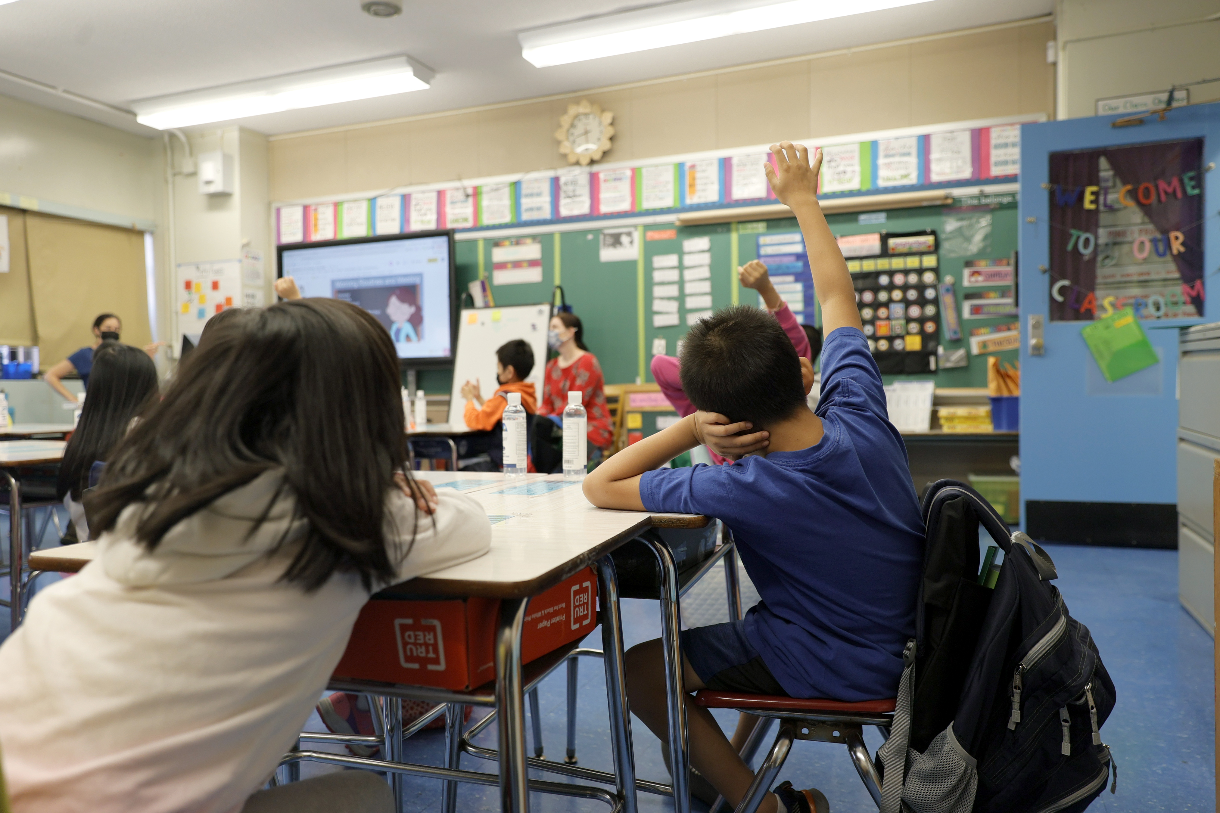 A stock photo of kids in a classroom.