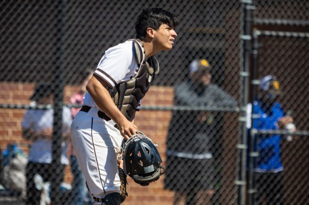 Mount Carmel's Mario Medina looks towards the outfield on a live ball during a Catholic League Blue game against St. Rita in Chicago on Saturday, April 13, 2024. (Vincent D. Johnson/for the Daily Southtown)