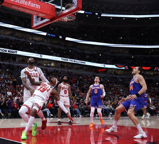 Chicago Bulls forward Torrey Craig (13) and center Andre Drummond (3) looks up from the floor as Craig misses a dunk in the first half of a game against the New York Knicks at the United Center in Chicago on April 9, 2024. (Chris Sweda/Chicago Tribune)