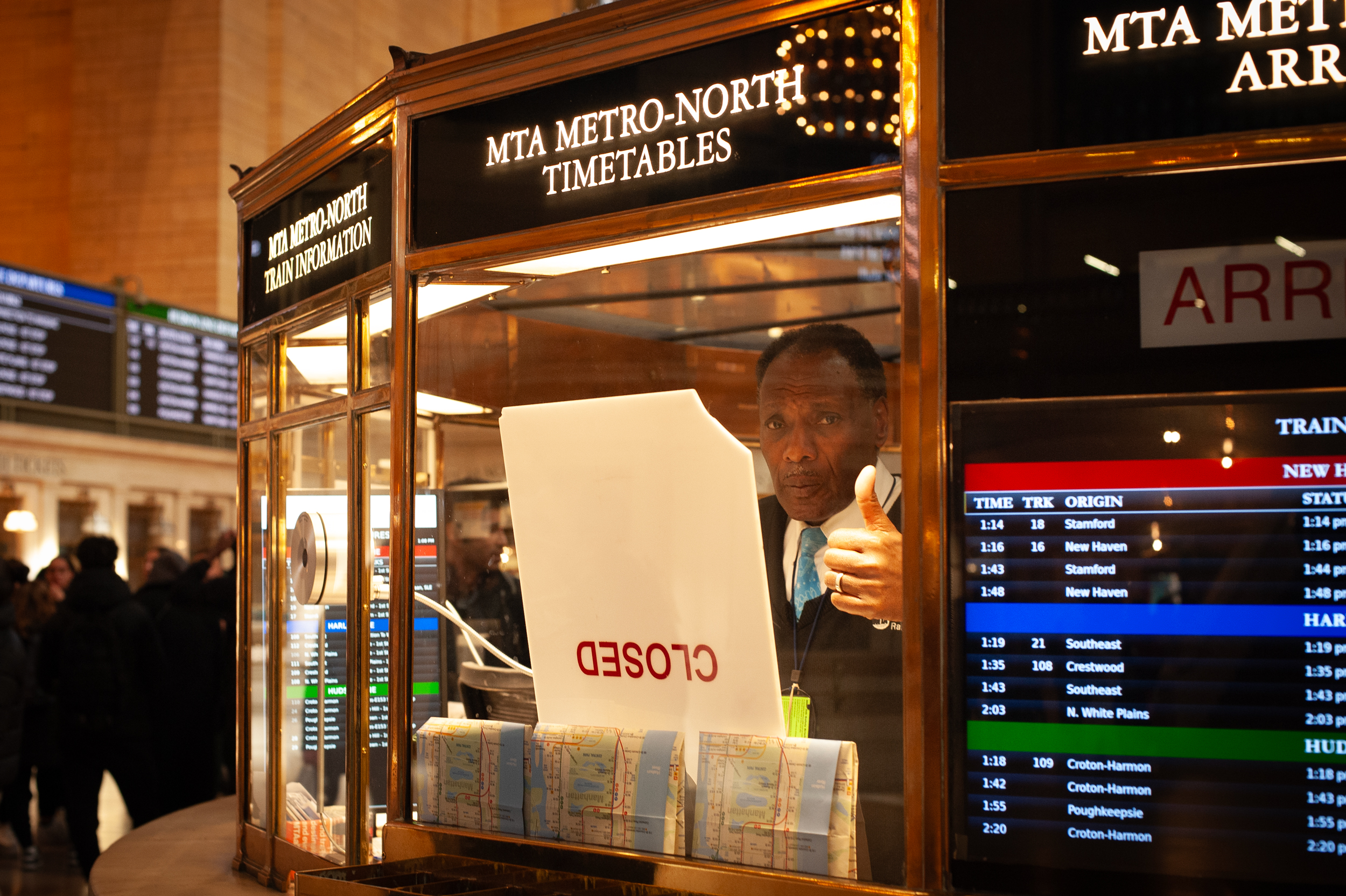 An information agent gives the thumbs up during a lunch rush in Grand Central Station on February 19, 2024.