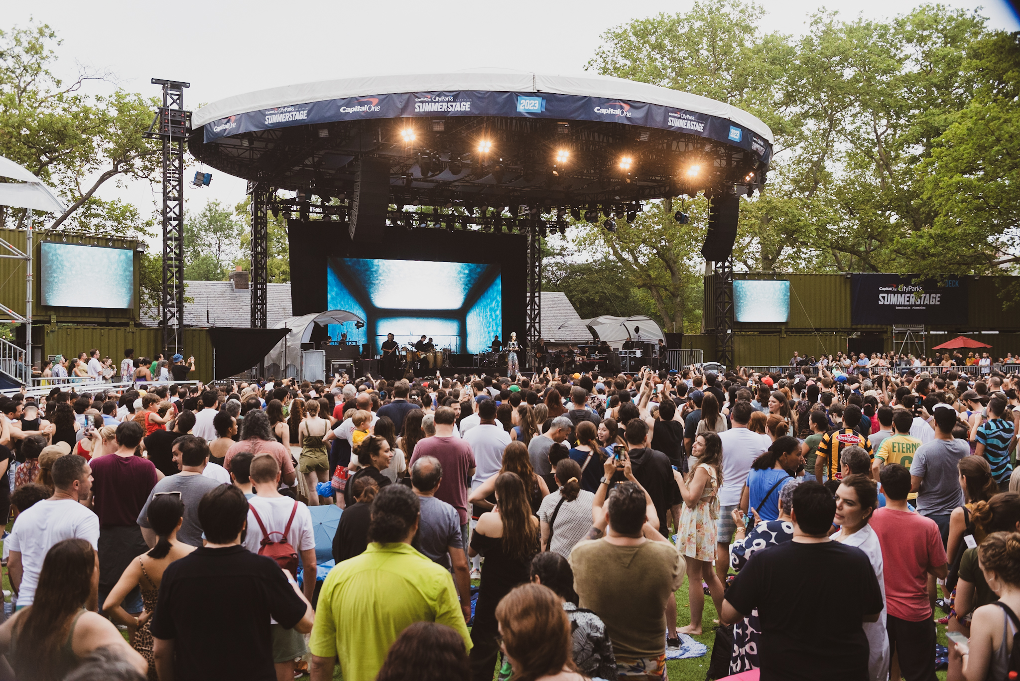 A crowd of people in front of a stage.