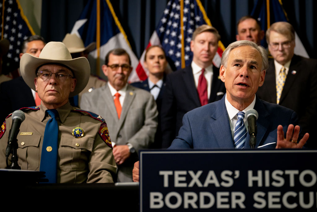 Gov. Greg Abbott speaks as Texas Department of Public Safety Director Steve McCraw and elected officials look on at a news conference at the state Capitol on June 8, 2023, in Austin. Abbott and McCraw joined bill authors, sponsors, legislators and law enforcement members in the signing of bills aimed at enhancing southern border security.