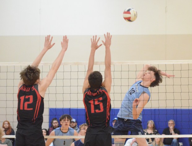 Reavis' Jozef Walus gets ready to pound a kill against Lincoln-Way Central during a match in the Smack Attack at the Oak Lawn Pavilion on Saturday, April 20, 2024. (Jeff Vorva / Daily Southtown)