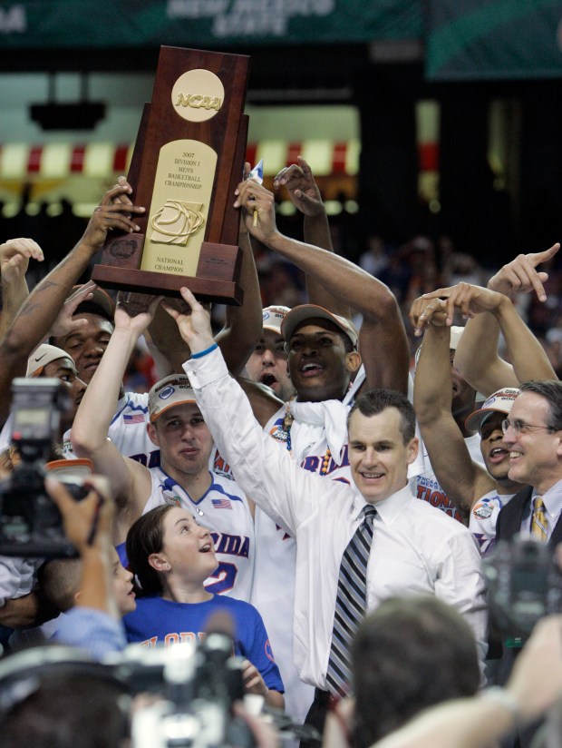 Billy Donovan celebrates with his Florida Gators after they won the NCAA national championship at the Georgia Dome in Atlanta on Monday, April 2, 2007. Florida beat Ohio State 84-75 (AP Photo/Mark Humphrey)