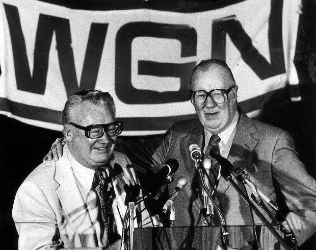Jack Brickhouse, right, introduces Harry Caray after Caray signed a two-year contract with WGN in November 1981 to broadcast Cubs games. (Walter Kale/Chicago Tribune)