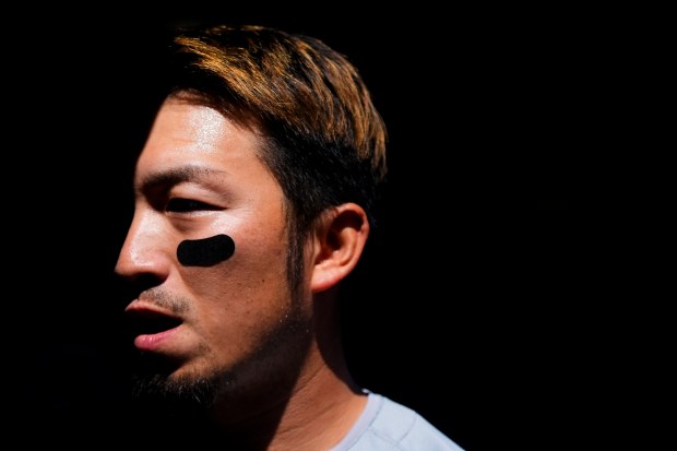 Cubs' Seiya Suzuki walks in the dugout before a game against the Mariners on April 14, 2024, in Seattle. (AP Photo/Lindsey Wasson)