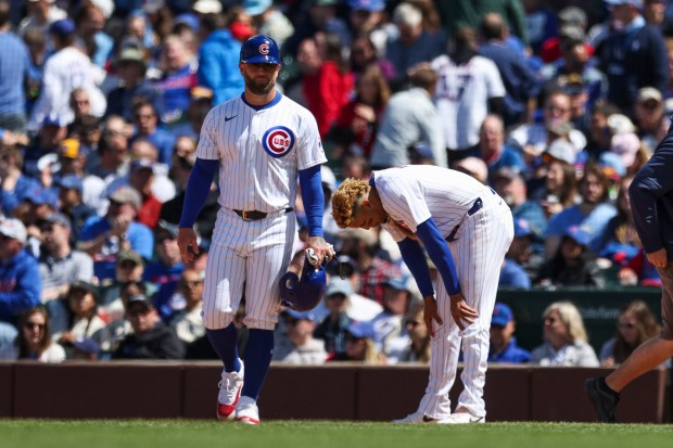 Chicago Cubs third base Christopher Morel (5) takes a moment after getting doubled up on a line drive from Chicago Cubs shortstop Dansby Swanson (7) during the fourth inning against the Milwaukee Brewers at Wrigley Field on May 5, 2024. (Eileen T. Meslar/Chicago Tribune)