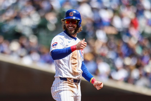 Chicago Cubs outfielder Patrick Wisdom (16) smiles after making to second base on a sacrifice bunt by Chicago Cubs outfielder Pete Crow-Armstrong (52) during the second inning against the Milwaukee Brewers at Wrigley Field on May 5, 2024. (Eileen T. Meslar/Chicago Tribune)
