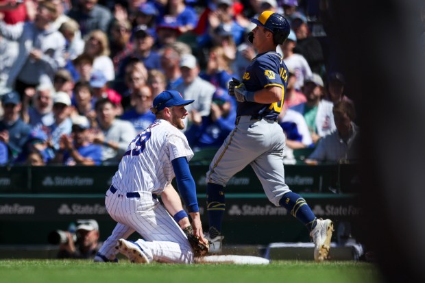 Chicago Cubs first base Michael Busch (29) smiles after making a play on the ball and diving to first base to get the runner out during the fifth inning against the Milwaukee Brewers at Wrigley Field on May 5, 2024. (Eileen T. Meslar/Chicago Tribune)