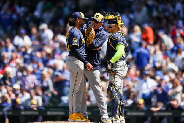 Milwaukee Brewers pitcher Freddy Peralta (51) has a meeting at the mound after giving up two runs during the fifth inning against the Chicago Cubs at Wrigley Field on May 5, 2024. (Eileen T. Meslar/Chicago Tribune)