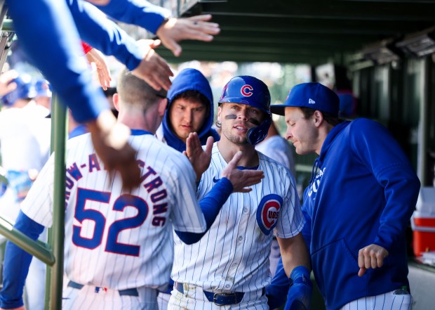 Chicago Cubs second baseman Nico Hoerner (2) celebrates after scoring a run on a wild pitch after getting a two-RBI double during the fifth inning against the Milwaukee Brewers at Wrigley Field on May 5, 2024. (Eileen T. Meslar/Chicago Tribune)