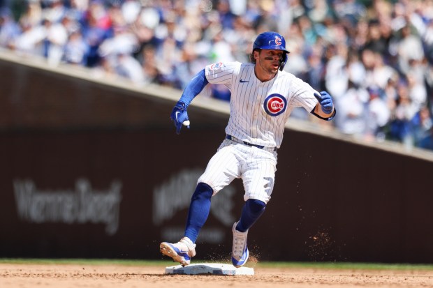 Chicago Cubs second baseman Nico Hoerner (2) runs to second after hitting a double during the fifth inning against the Milwaukee Brewers at Wrigley Field on May 5, 2024. (Eileen T. Meslar/Chicago Tribune)
