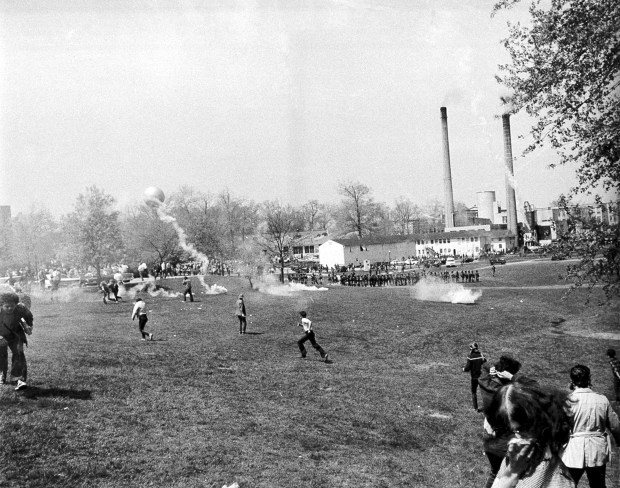 FILE - A general view shows tear gas and students during an anti-Vietnam war protest at Kent State University in Kent Ohio, May 4, 1970. U.S. National Guardsmen opened fire during the protests killing four students and wounding five. (AP Photo/Larry Stoddard, File)