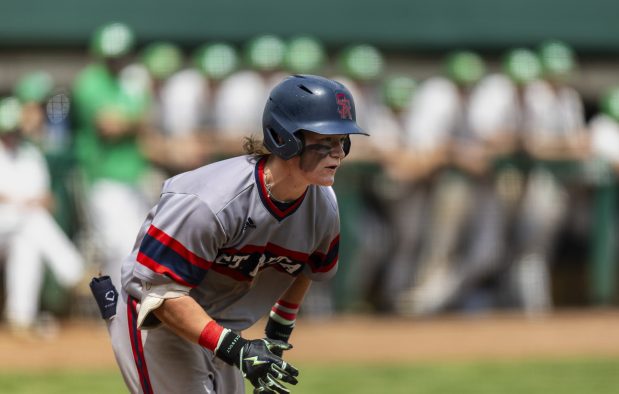 St. Rita's Peyton Panozzo hustles to first after making contact on a pitch against Providence during a Catholic League Blue game in New Lenox on Saturday, May 4, 2024. (Vincent D. Johnson/for the Daily Southtown)