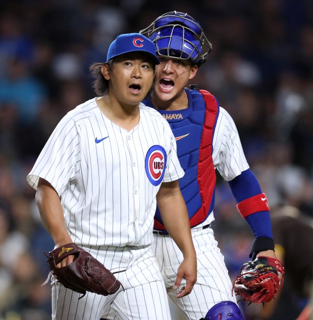 Chicago Cubs starting pitcher Shota Imanaga and catcher Miguel Amaya (9) celebrate as they walk off the field after getting the final out of the sixth inning against the San Diego Padres at Wrigley Field in Chicago on May 7, 2024. (Chris Sweda/Chicago Tribune)