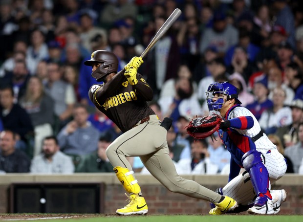 San Diego Padres outfielder Jurickson Profar (10) hits a two-run home run in the 8th inning of a game against the Chicago Cubs at Wrigley Field in Chicago on May 7, 2024. (Chris Sweda/Chicago Tribune)