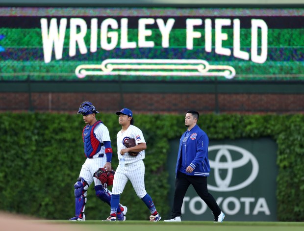 Chicago Cubs catcher Miguel Amaya (9) and pitcher Shota Imanaga (18) walk in from the bullpen before Imanaga's start against the San Diego Padres at Wrigley Field in Chicago on May 7, 2024. (Chris Sweda/Chicago Tribune)