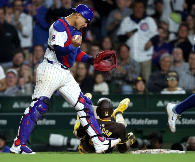 Chicago Cubs catcher Miguel Amaya (9) celebrates after tagging out San Diego Padres baserunner José Azocar during a rundown to end the top of the seventh inning of a game at Wrigley Field in Chicago on May 7, 2024. (Chris Sweda/Chicago Tribune)