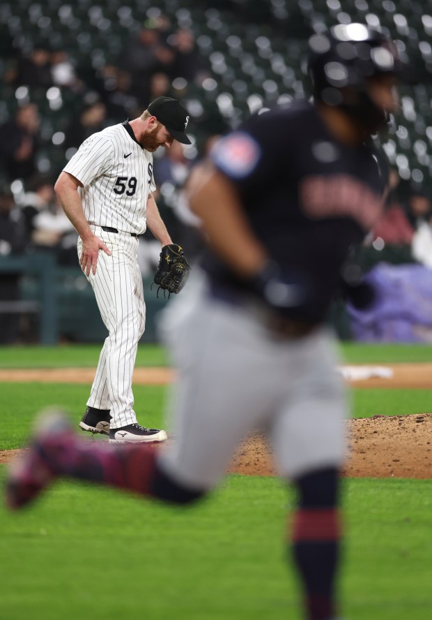 Chicago White Sox relief pitcher John Brebbia (59) reacts on the mound after giving up a solo home run to Cleveland Guardians first baseman Josh Naylor (foreground) in the 8th inning of a game at Guaranteed Rate Field in Chicago on May 9, 2024. (Chris Sweda/Chicago Tribune)