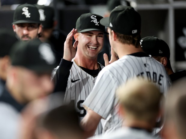 White Sox reliever Jordan Leasure, center, and starting pitcher Erick Fedde, right, celebrate after Leasure got out of a jam to end a scoreless seventh inning against the Guardians on May 9, 2024, at Guaranteed Rate Field. (Chris Sweda/Chicago Tribune)
