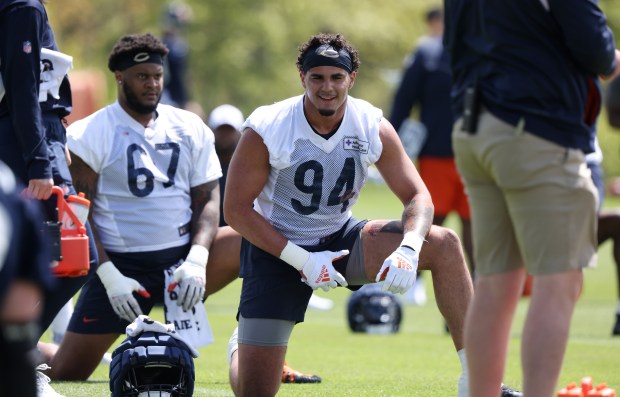 Defensive lineman Austin Booker (94) stretches during Bears rookie minicamp on May 11, 2024, at Halas Hall in Lake Forest. (John J. Kim/Chicago Tribune)