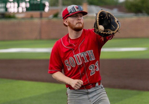 Thornton Fractional South's Jack Starcevich (23) catches a ball from the dugout during a game in Evergreen Park on Thursday, May 16, 2024. (Nate Swanson/for the Daily Southtown)