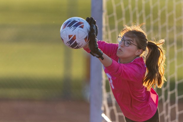 Homewood-Flossmoor's Cristina Ramirez stops Lincoln-Way West's final penalty kick from Abby Hermanson, during the Class 3A Homewood-Flossmoor Regional championship game in Flossmoor on Friday, May 17, 2024. (Vincent D. Johnson/for the Daily Southtown)