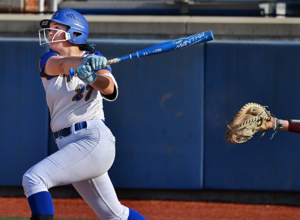 Aurora Central Catholic's Amelia Lohrey belts a lead off double to left center field against Richmond-Burton during the Class 2A Aurora Central Catholic Regional championship game on Friday, May 17, 2024, in Aurora.(Jon Cunningham/for The Beacon-News)