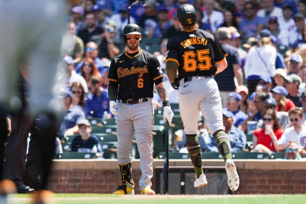 Pittsburgh Pirates catcher Yasmani Grandal (6) celebrates with outfielder Jack Suwinski (65) after Suwinski hit a home run during the second inning against the Pittsburgh Pirates at Wrigley Field on May 19, 2024. (Eileen T. Meslar/Chicago Tribune)