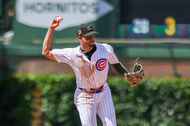 Chicago Cubs third base Christopher Morel (5) the ball to second base during the sixth inning against the Pittsburgh Pirates at Wrigley Field on May 19, 2024. (Eileen T. Meslar/Chicago Tribune)