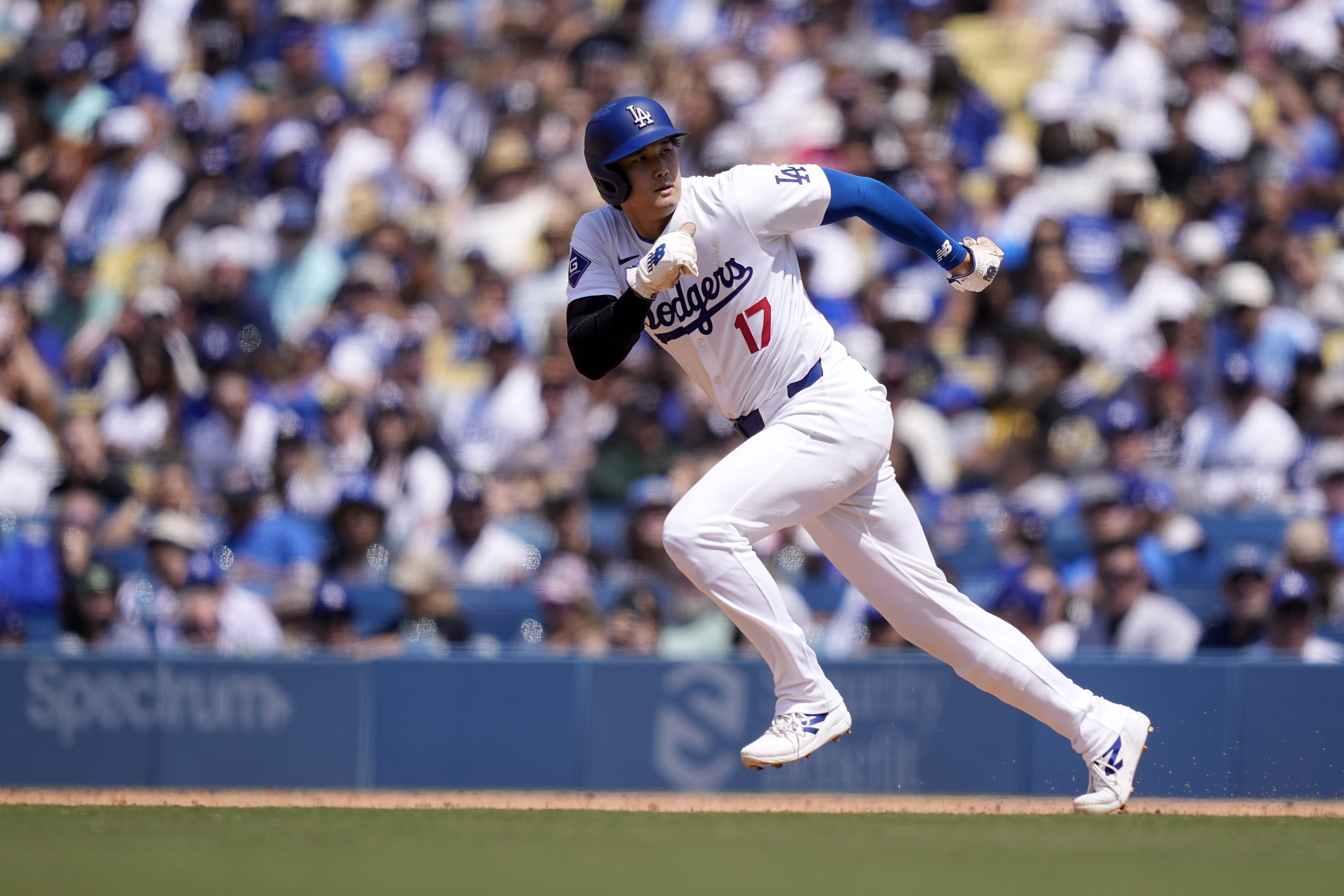 Los Angeles Dodgers’ Shohei Ohtani heads to second as Freddie...