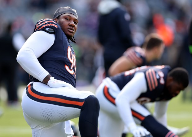 Bears defensive tackle Gervon Dexter stretches before a game against the Vikings on Oct. 15, 2023, at Soldier Field. (Chris Sweda/Chicago Tribune)