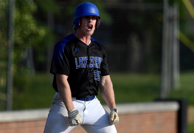 Lake Zurich's Owen Strahl (25) celebrates getting to third base on a error. Lake Zurich defeated Highland Park 13-0 in the Class 4A Libertyville Regional semifinal baseball game at Libertyville, Thursday May 23, 2024. (Rob Dicker/for the Lake New-Sun)