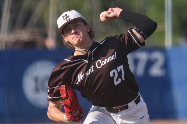 Mount Carmel's Ian Tosi (27) throws a pitch during the Class 4A Reavis Regional semifinal against Oak Lawn in Burbank on Thursday, May 23, 2024. (Troy Stolt/for the Daily Southtown)