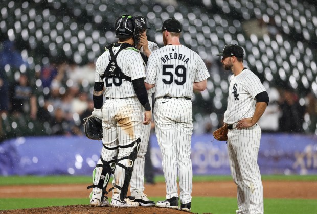 White Sox pitcher John Brebbia (59) takes a meeting on the mound in the eighth inning against the Orioles at Guaranteed Rate Field on May 24, 2024, in Chicago. (John J. Kim/Chicago Tribune)