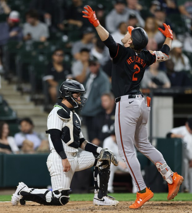 White Sox catcher Korey Lee (26), left, waits for Orioles shortstop Gunnar Henderson (2) to finish celebrating after Henderson hit a two-run home run in the fifth inning at Guaranteed Rate Field on May 24, 2024, in Chicago. (John J. Kim/Chicago Tribune)