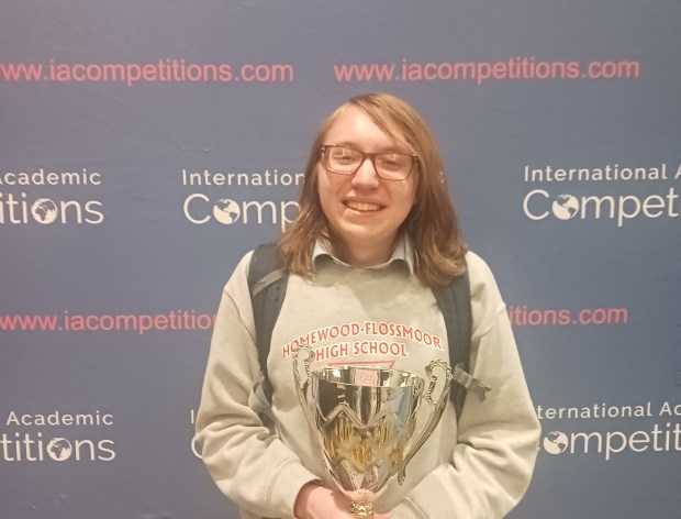 Jack Piros holds his trophy after winning the 2024 National Political Science Bee April 25 in Arlington, Virginia. The Homewood-Flossmoor Community High School graduating senior loves politics and history and had plenty of practice leading up to the event. (Michael Sacks)