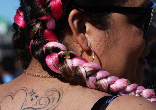 A concertgoer wears multicolored braids during the Sueños Music Festival at Grant Park on May 25, 2024, in Chicago. (John J. Kim/Chicago Tribune)