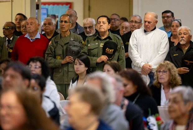 Veterans line up on May 26, 2024, during a Memorial Day ceremony in South Chicago to honor 12 men from the community who died in the Vietnam War. Part of the event was moved indoors to Our Lady of Guadalupe Church due to the rain. (Brian Cassella/Chicago Tribune)