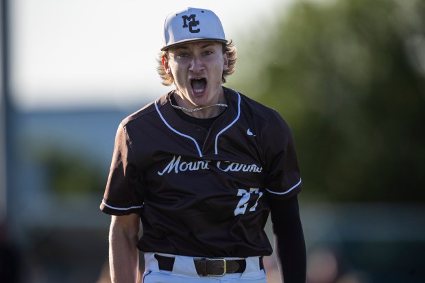 Mount Carmel's Ian Tosiin shouts for joy after the final out against Brother Rice in the Class 4A Reavis Sectional semifinal in Burbank on Wednesday, May 29, 2024. (Vincent D. Johnson/for the Daily Southtown)